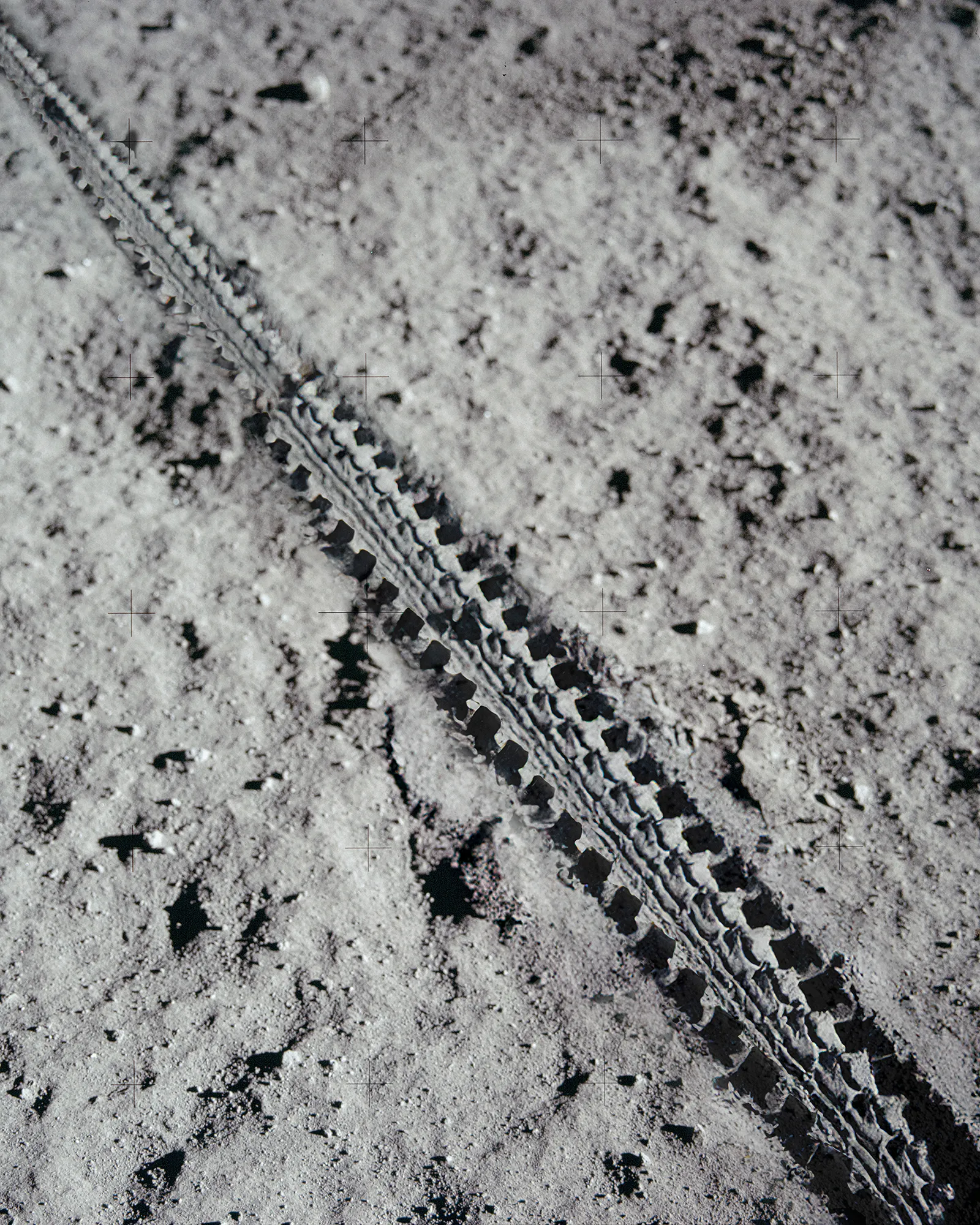Close-up of a rugged tire track on lunar soil, symbolizing BESV MY26’s all-terrain capabili
