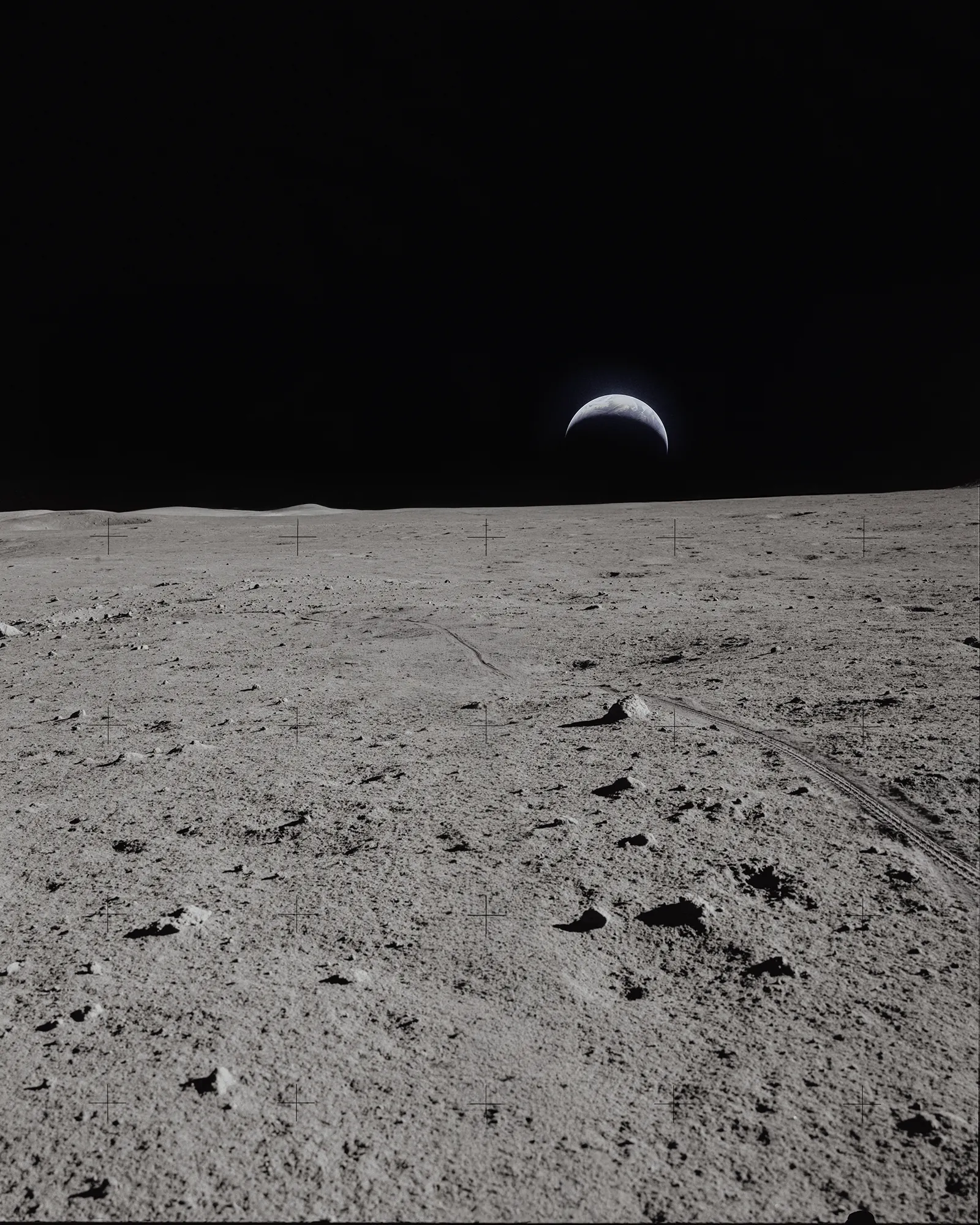BESV Mission MY26 teaser image showing the Earth rising above a moon landscape with visible rover tracks